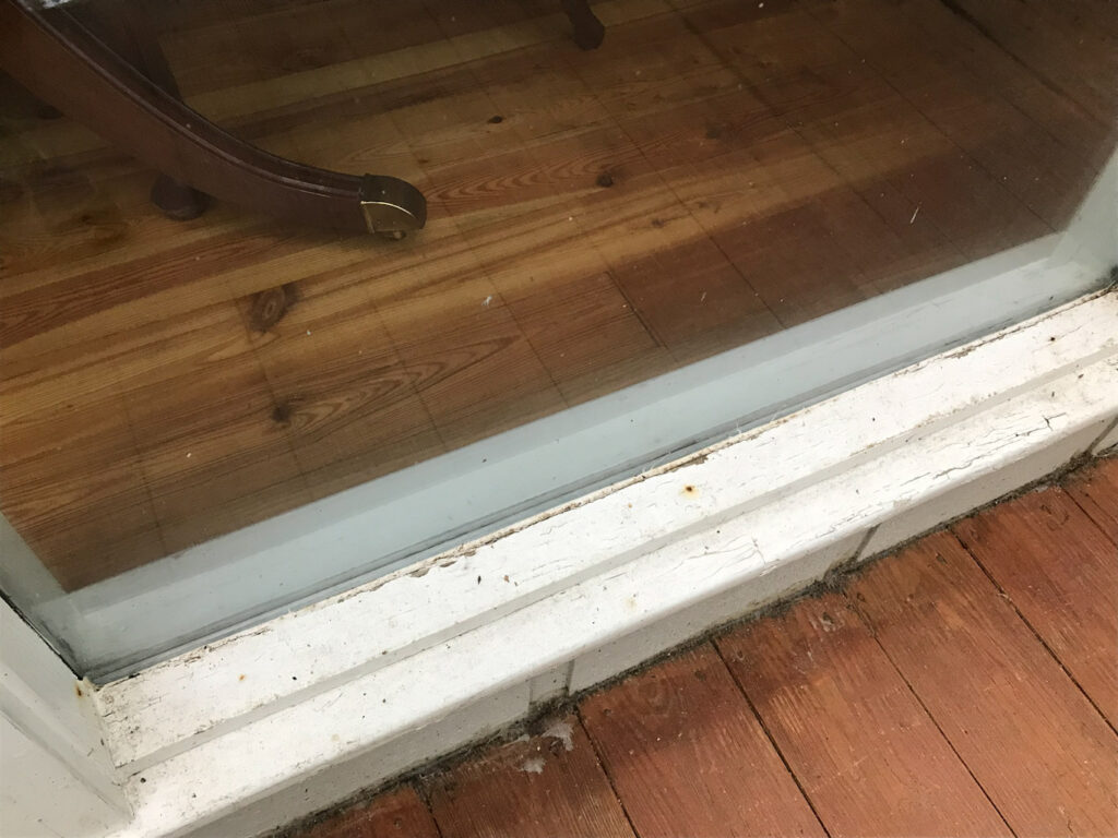 Painted Window sill that needs cleaning and painting