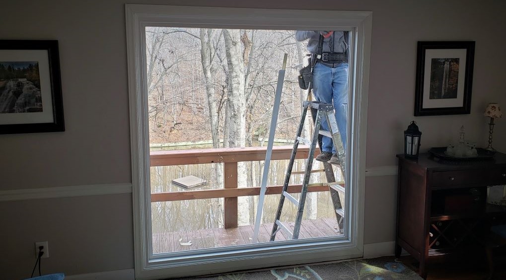 Recycling Windows and move to Another Location 10 Replacement Windows large picture window by lake - exterior trim installed