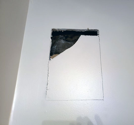 Cutting out sheetrock to mount rear surround speaker flush with the wall