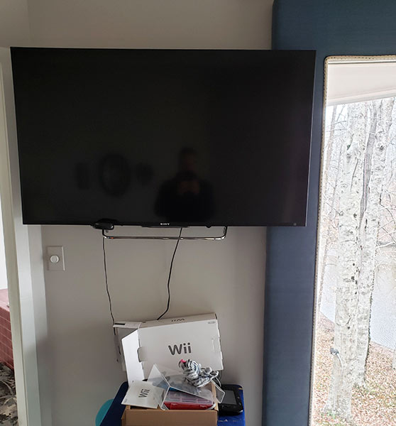 Lambrequin board in way of wall mounted TV