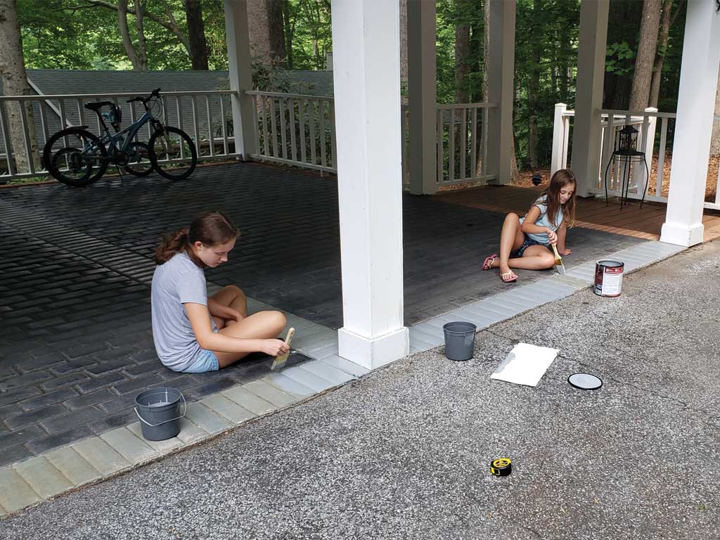 Two girls learn How to Clean and Paint a Cement Floor in One DAY