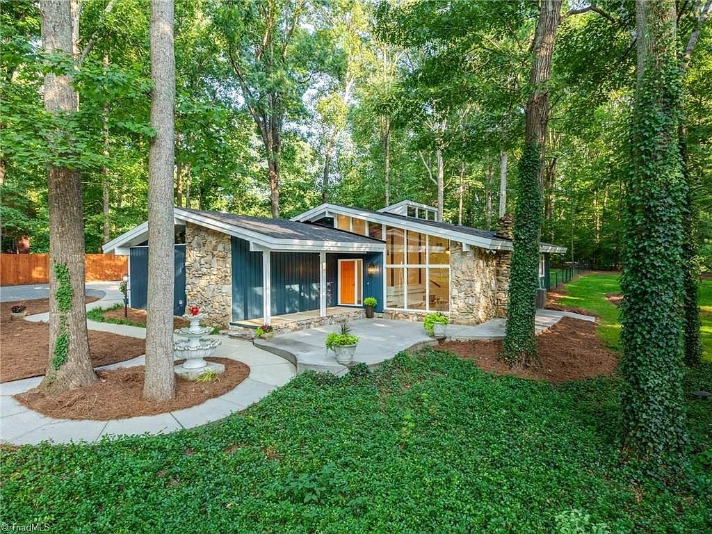 House Tour: Period Perfection 1973 Mid-Century Modern 2 1973 Mid-Century Modern Front Door orange door