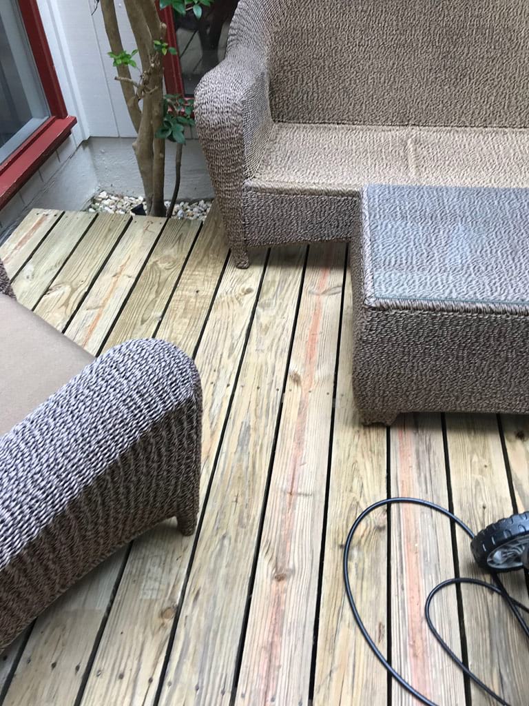 Cleaned deck and patio furniture removing mold and mildew