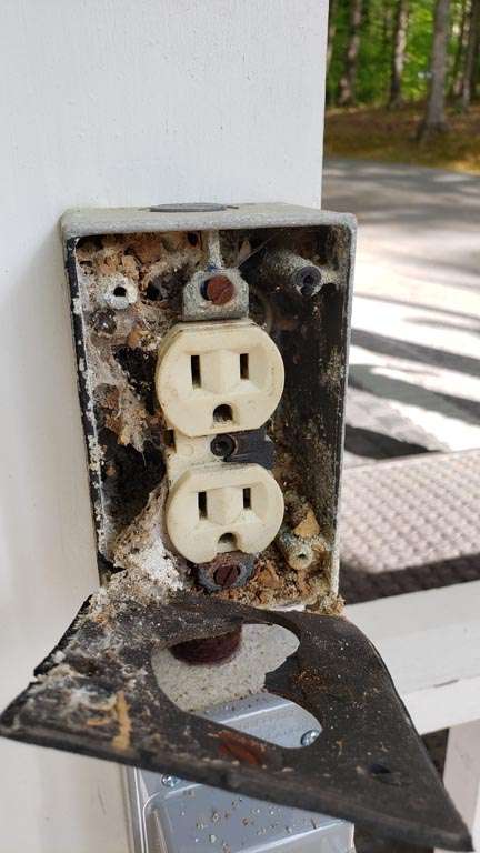 dirty electrical outlet in need of cleaning