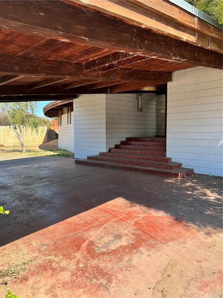 Carport and entrance to house right side