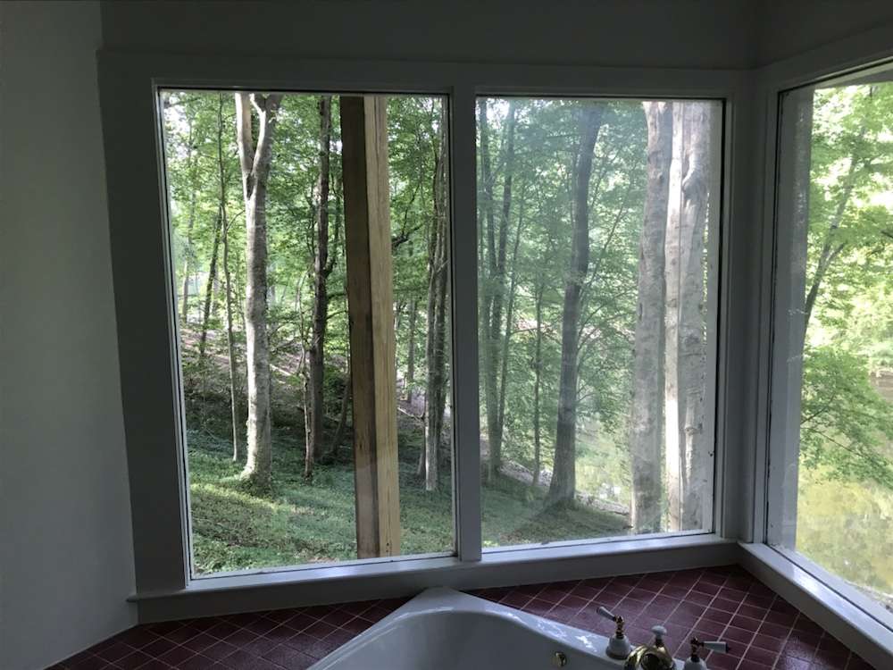 Old bathroom solid panel (does not open) window
