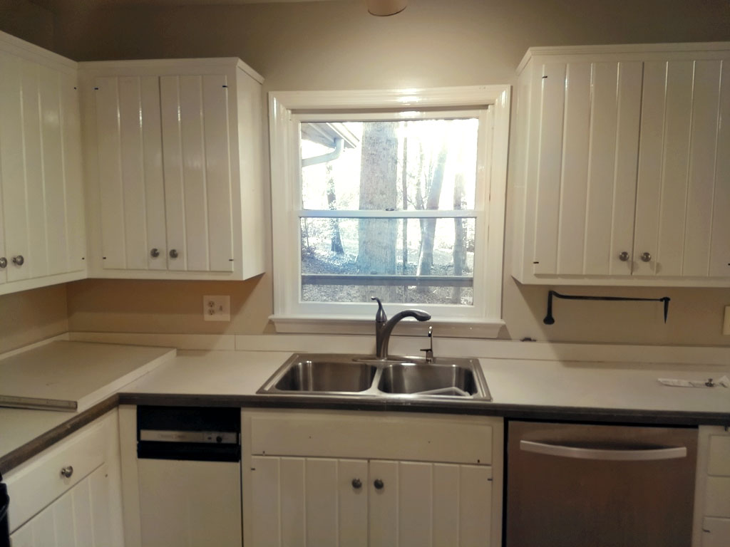 Old kitchen counter tops in our MCM House, a Mid Century Nightmare