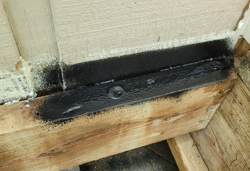 Flex seal sprayed on top of ledger boards and siding